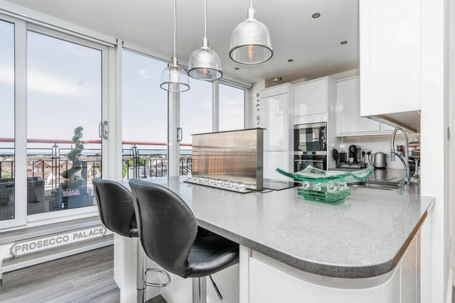 The kitchen is modern and stylish throughout and has beautiful views of the city outside.