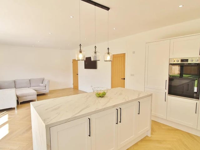This property comes with 2 dressing rooms, a utility room and a huge open-plan kitchen.