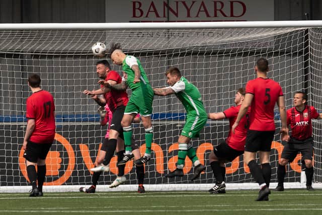 James Willis (green, left) and Ash Wheatley in action for Carberry during their title-winning victory against Horndean United. Picture: Keith Woodland
