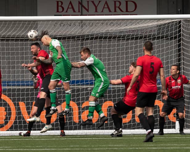 James Willis (green, left) and Ash Wheatley in action for Carberry during their title-winning victory against Horndean United. Picture: Keith Woodland