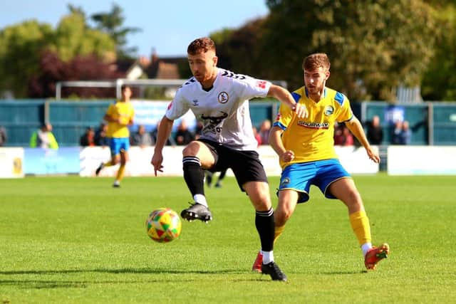 Harvey Rew, right, keeps a close eye on a North Leigh opponent. Picture by Tom Phillips