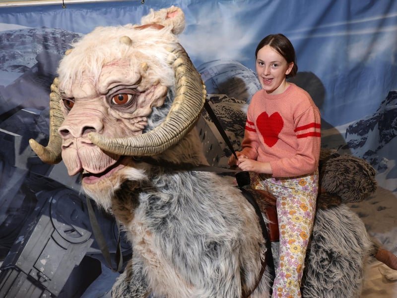 Pictured is (L-R) Isabelle Davis on a Star Wars animal.