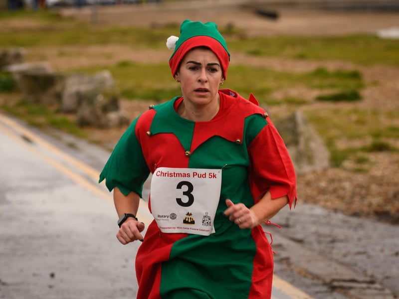 A Christmas elf completes the run at Stokes Bay, Gosport
