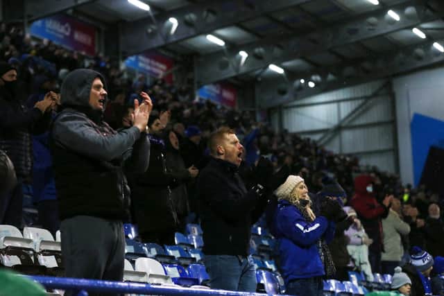 Pompey fans celebrate Jack Whatmough's goal against Peterborough. Picture: Joe Pepler
