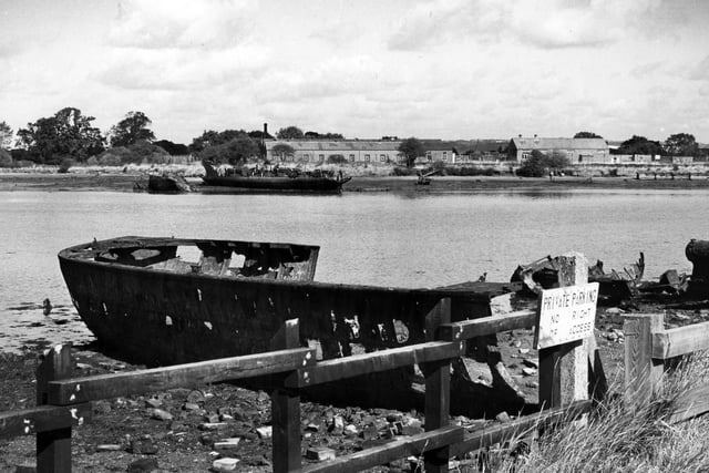 The old ship wrecks scattered along Forton Lake, Gosport in 1988. The News PP4758