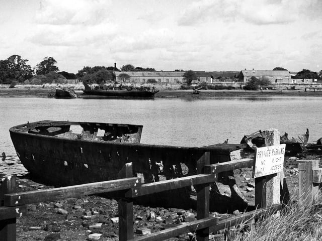 The old ship wrecks scattered along Forton Lake, Gosport in 1988. The News PP4758
