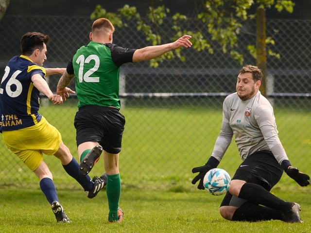 Action from Saturn Royale's 1-0 win over Pelham Arms (blue and yellow kit) in the second Adelaide Cup semi-final. Picture: Keith Woodland (300421-630)