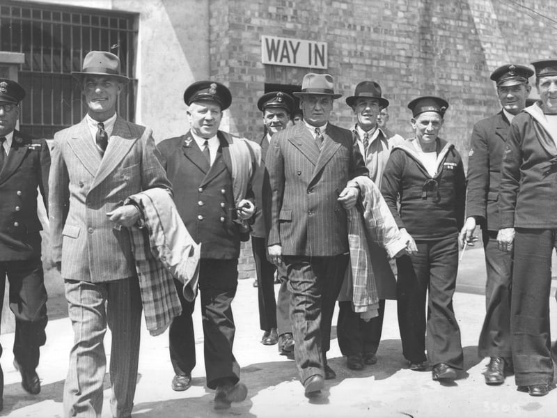 Demobilised sailors who have just been issued their demobilisation clothing with sailors who are still in uniform. This photograph probably dates from 6.1945 and the location is probably the Demobilisation Clothing Centre at Cosham [at the Portsdown Motor Garage]. Not specifically relating to D-Day but some of these men may well have taken part in that operation.