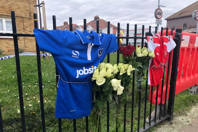 Two football shirts have been left alongside almost a dozen bouquets of flowers at the site of a fatal crash in Hilsea.