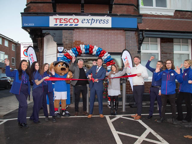 A new Tesco Express has opened in St George's Road, Old Portsmouth on Wednesday 15th November 2023Pictured: MP Stephen Morgan with staff outside the Tesco Express store with Nelson the Pompey mascot marking the opening of the storePicture: Habibur Rahman