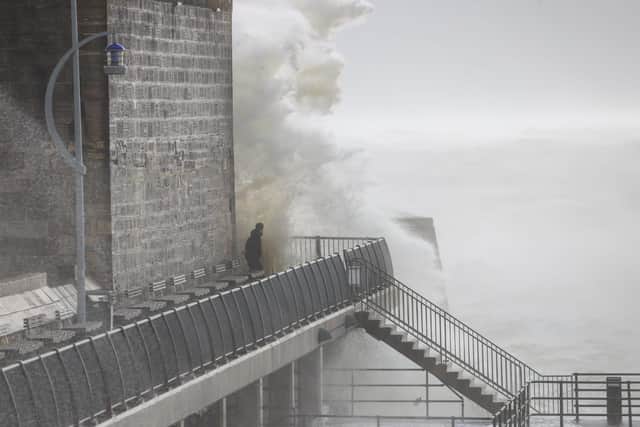 Storm chaser faces down Eunice in Old Portsmouth. Picture: Alex Shute
