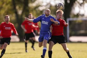 Joe Stevens (left) and Jamie Hayden (Wymering) in action for FC Strawberry's 2-0 Mid-Solent League victory at the weekend. Picture: Chris Moorhouse