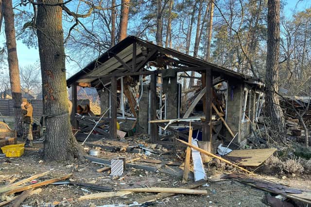 Hours before the artillery barrage, Shane had been sheltering in this summer house, which was razed to the ground by the strikes.