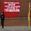 Banners critical of the European Super League project  hang from the railings of Anfield stadium, home of English Premier League football club Liverpool on April 21, 2021. Photo by Paul Ellis / AFP via Getty Images