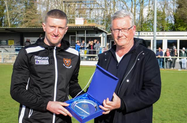 Lee Wort, left, was presented with an award by finance director Trevor Deacon for reaching 50 goals for the club following his double in AFC Portchester's win over Bournemouth Picture: Daniel Haswell