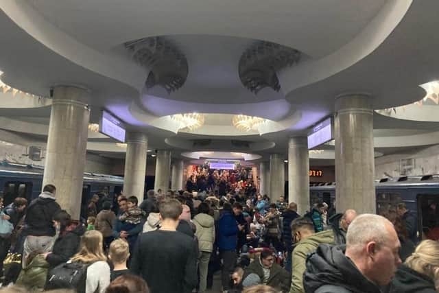 Nataliia Diomidova took photos of people trying to flee Ukraine after the invasion.
Pictured: People at a train station trying to get away.