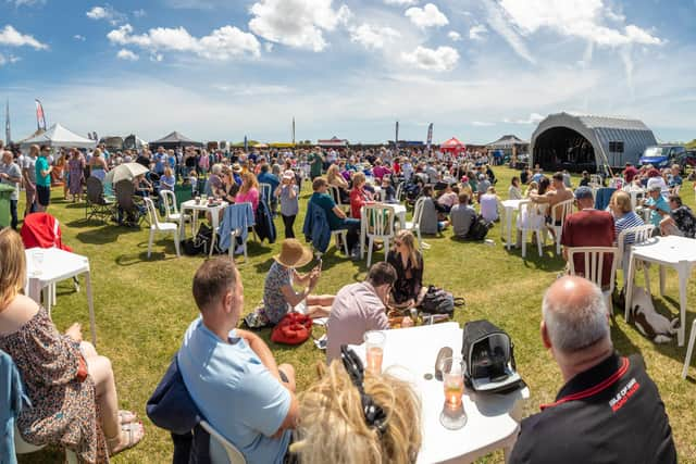 Festival goers enjoying the fantastic weather. Picture: Mike Cooter (210522)