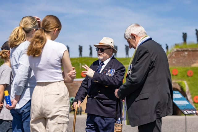 Veterans Alan Day and Ian Mathews speak with members of the public who attended the event at the Royal Armouries.