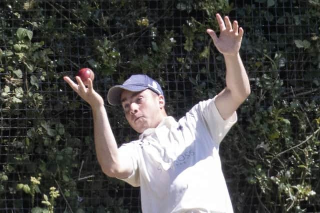 Portsmouth's Dan Wallis takes a catch on the boundary against Sparsholt. Picture: Bob Selley.