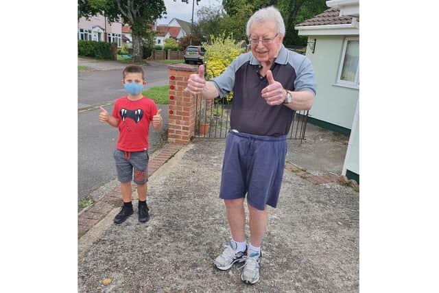 Kobe Brown, 7, is running a mile a day to raise money for Parkinson's UK because his grandad has the neurological condition. Pictured: Kobe with grandad John Manning, 73