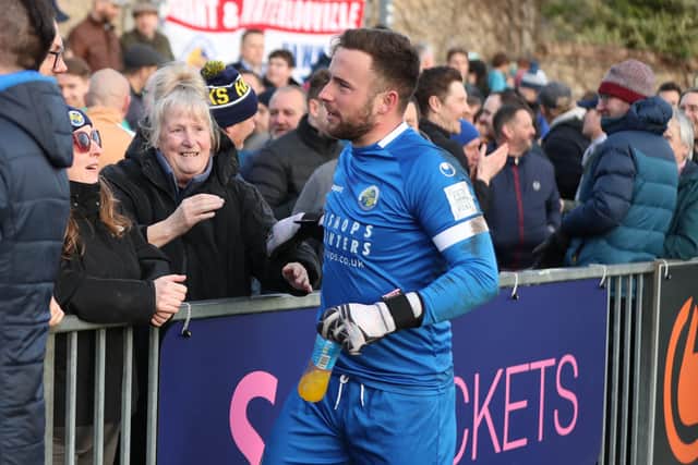 Goalkeeper Charlie Searle heads over to the visiting Hawks following after the victory at Dulwich Hamlet Picture: Dave Haines