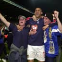 Nigel Quashie celebrates with Pompey fans after sealing promotion to the Premier League in April 2003. Picture: Jonathan Brady