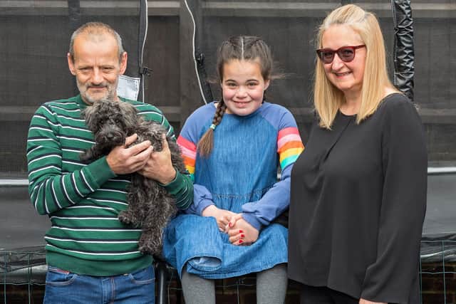 Spencer Crockford-Reid, Maddi Crockford-Reid (13) and Shelly Reid with their pet dog Mogo Moon. Picture: Mike Cooter (220521)