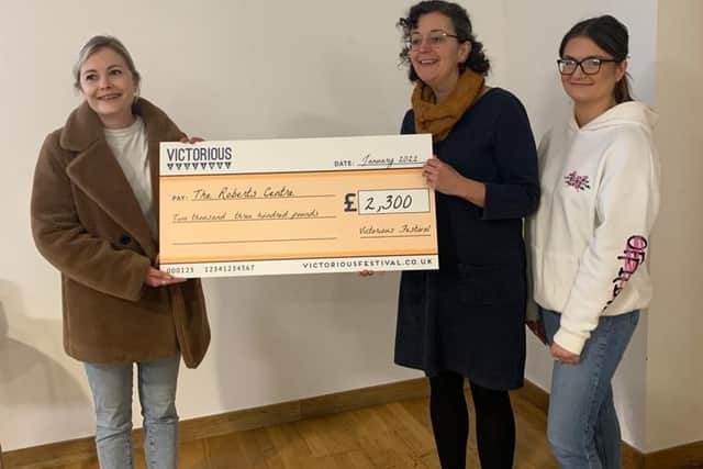 The team at The Roberts Centre receiving the cheque.