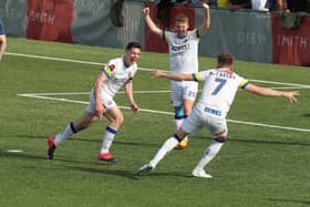 James Roberts scores Hawks' third goal in their 3-0 win over Hampton & Richmond. Picture by Dave Haines