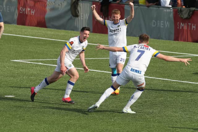 James Roberts scores Hawks' third goal in their 3-0 win over Hampton & Richmond. Picture by Dave Haines