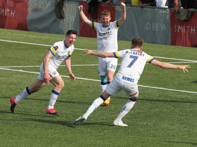 James Roberts scores Hawks' third goal in their 3-0 win over Hampton & Richmond. Picture by Dave Haines