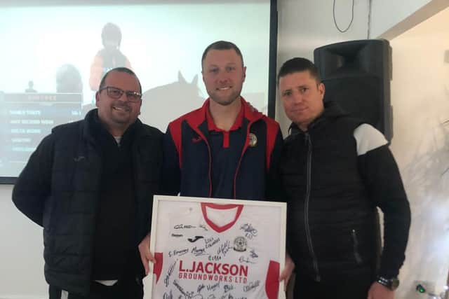 Louie Martin, centre, with Horndean boss Michael Birmingham, left, and assistant manager Jason Mann