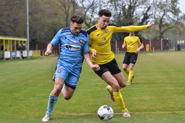 Joe Briggs (blue) on his AFC Portchester debut at Hamble Club. Picture: Daniel Haswell.