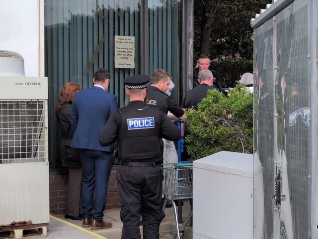 Police at the scene where a dead body was found in Wharf Road on Friday