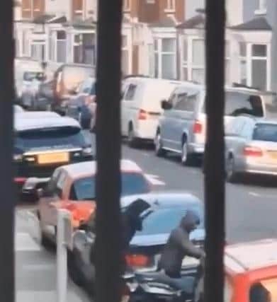 Two hooded youths were pictured taking the bike in North End.