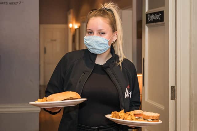 Jade Berry serving up lunch as indoor service resumes at the Old Customs House in Gunwharf Quays. Picture: Mike Cooter (170521)