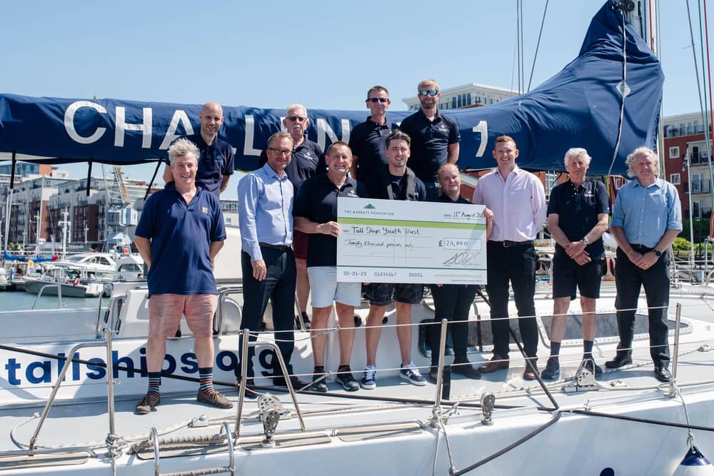 Barratt Homes employees are invited on board as they present Tall Ships Youth Trust (TSYT) with a cheque for £20,000.