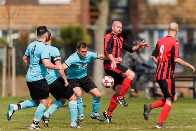 Action from Horndean United Reserves' (red and black) Portsmouth Sunday League battle with North End Reserves. Picture: Keith Woodland (180421-163)