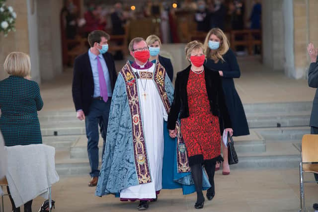 Bishop Christopher leaves Portsmouth Cathedral holding the hand of his wife, the Rev Sally Davenport, who is retiring as team rector of Holy Trinity and St Columba Church, Fareham.