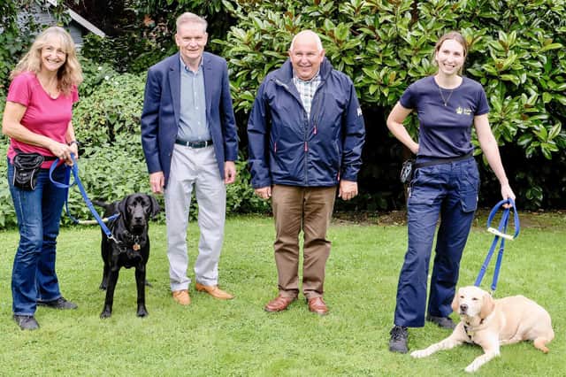 From left - Puppy Raiser Mandy with pup Joshua, Steve Allum and Dave Wood, head of Hampshire and IoW Royal Arch Freemasons and their charity lead respectively, and Puppy Development Advisor Steph with pup Benny.