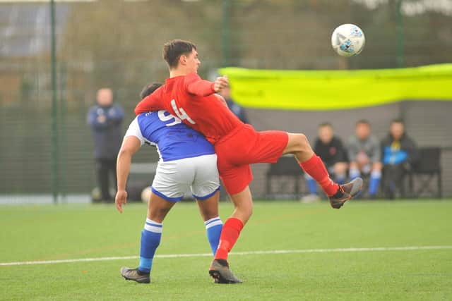 A Denmead player is grabbed around the neck against Sway at Front Lawn. Picture: Martyn White