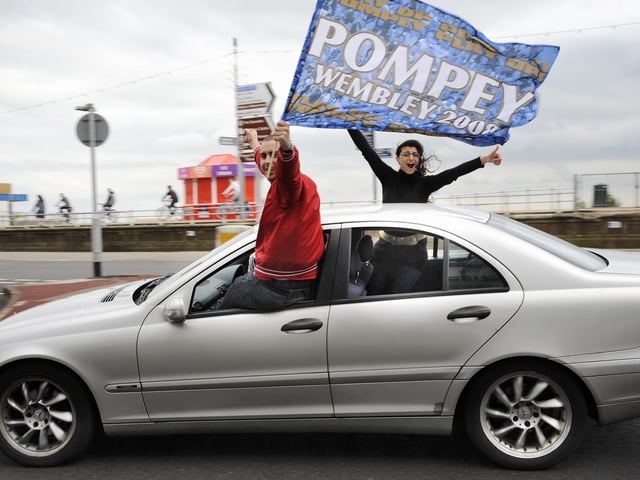 Flying the flag for Pompey on South Parade, Southsea, after watching the Blues win the FA Cup at Wembley.PICTURE: MICHAEL SCADDAN