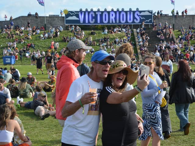 Festival-goers take a selfie in front of the Victorious sign at the Victorious Festival in Southsea
Picture: Ben Mitchell/PA Wire