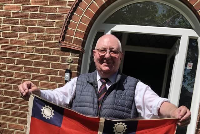 Proud Tony Simms, 81, of Military Road, Hilsea, holding the flag he last displayed during VE Day on May 8, 1945.