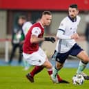 Northern Ireland's Conor McLaughlin under pressure from Marko Arnautovic of Austria. (Photo by Christian Hofer/Getty Images)