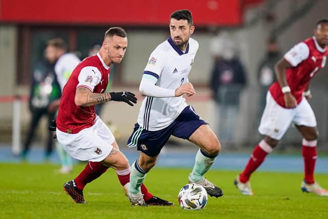 Northern Ireland's Conor McLaughlin under pressure from Marko Arnautovic of Austria. (Photo by Christian Hofer/Getty Images)
