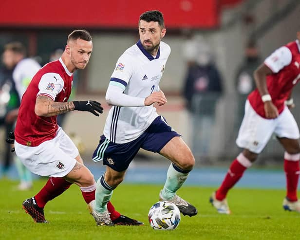 Northern Ireland's Conor McLaughlin under pressure from Marko Arnautovic of Austria. (Photo by Christian Hofer/Getty Images)