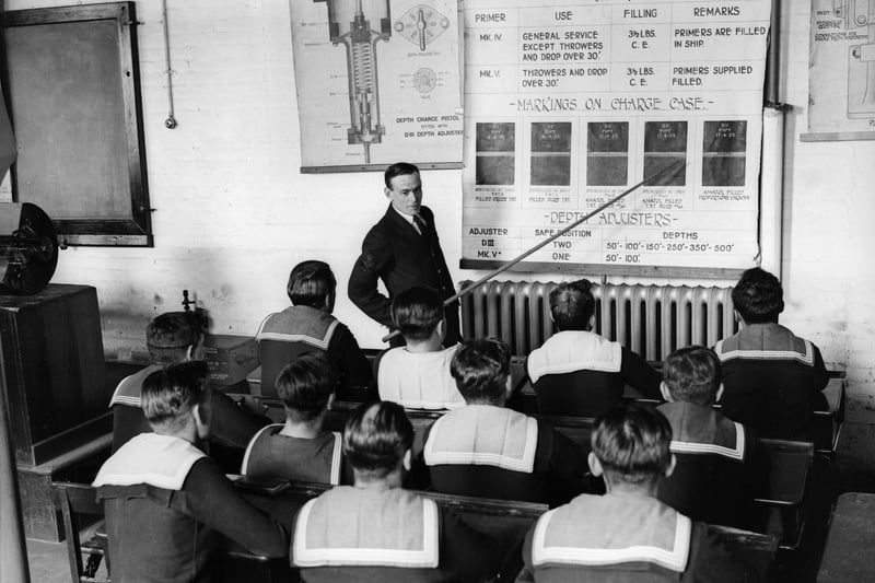 5th September 1931. Sailors on board the naval vessel HMS Vernon attend a class on the use of depth charges during a stay at Portsmouth.  (Photo by Fox Photos/Getty Images)