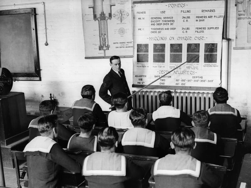 5th September 1931. Sailors on board the naval vessel HMS Vernon attend a class on the use of depth charges during a stay at Portsmouth. (Photo by Fox Photos/Getty Images)