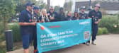 Joel (centre) with QA Hospital staff who marched from London to Portsmouth in aid of SayAphasia.